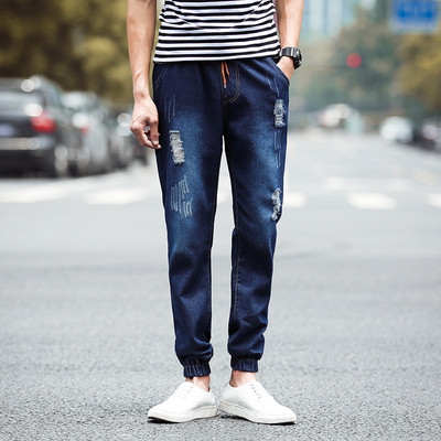 Modern férfi farmer két színben, fűzős, szakadt motívumokkal