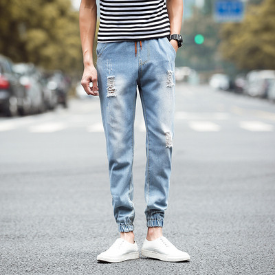 Modern férfi farmer két színben, fűzős, szakadt motívumokkal