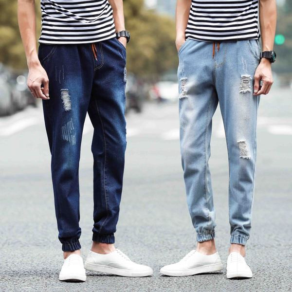 Modern férfi farmer két színben, fűzős, szakadt motívumokkal