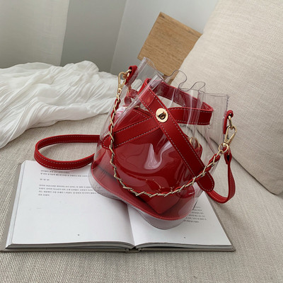 Κομψή γυναικεία τσάντα με διαφανές κάλυμμα σε τέσσερα χρώματα με μεταλλική αλυσίδα