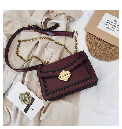 Stílusos női táska három színben fém csattal és hosszú fém fogantyúval