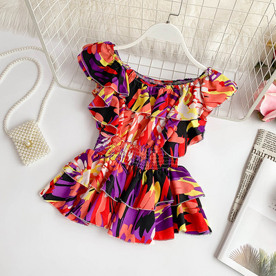 Μοντέρνα γυναικεία μπλούζα σε διάφορα χρώματα με πολύχρωμο πριντ