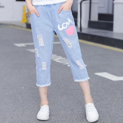 Blugi de copii pentru fete cu aplicații și motive rupte