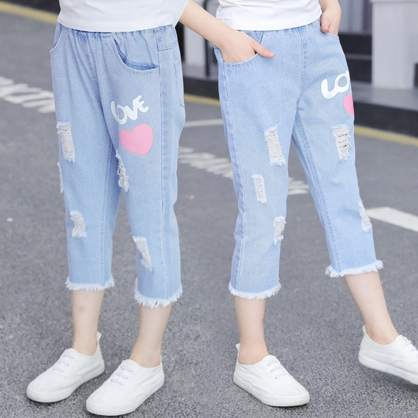 Blugi de copii pentru fete cu aplicații și motive rupte