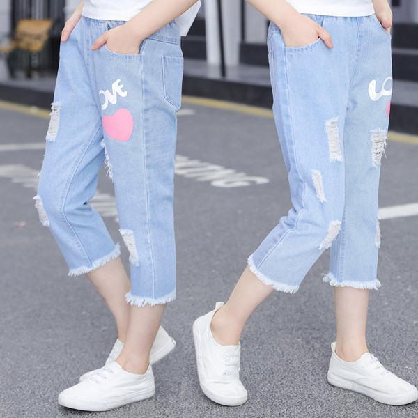 Blugi de copii pentru fete cu aplicații și motive rupte