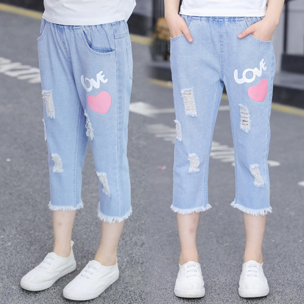 Blugi de copii pentru fete cu aplicații și motive rupte