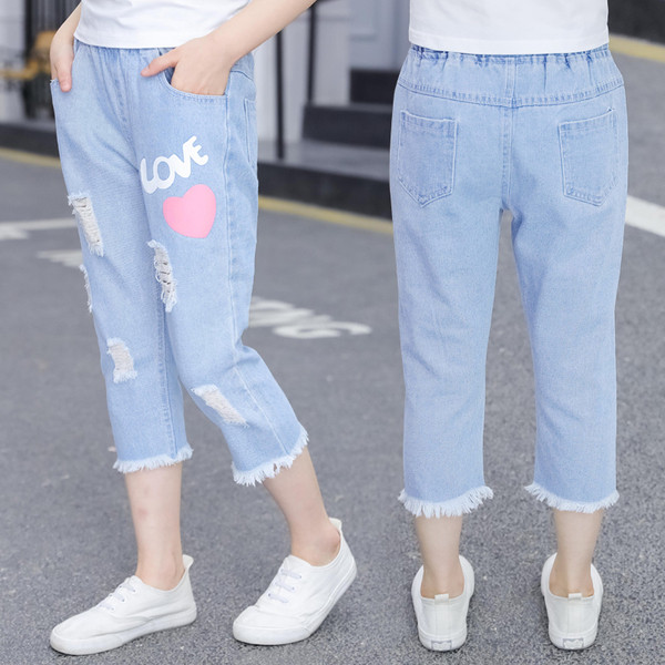 Blugi de copii pentru fete cu aplicații și motive rupte