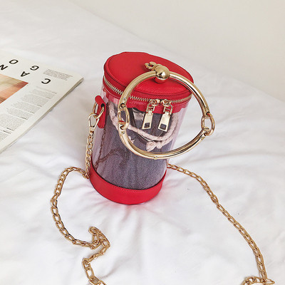 Κομψή γυναικεία τσάντα με μεταλλικές λαβές και διαφανές δερμάτινο κάλυμμα σε τρία χρώματα