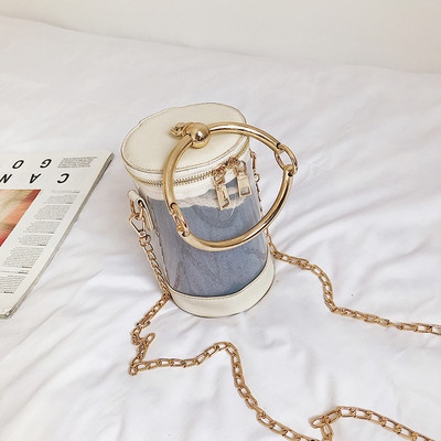 Κομψή γυναικεία τσάντα με μεταλλικές λαβές και διαφανές δερμάτινο κάλυμμα σε τρία χρώματα