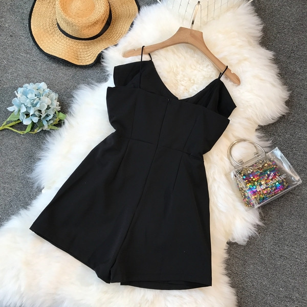 Stílusos női overall, fekete színben, V-nyakkal