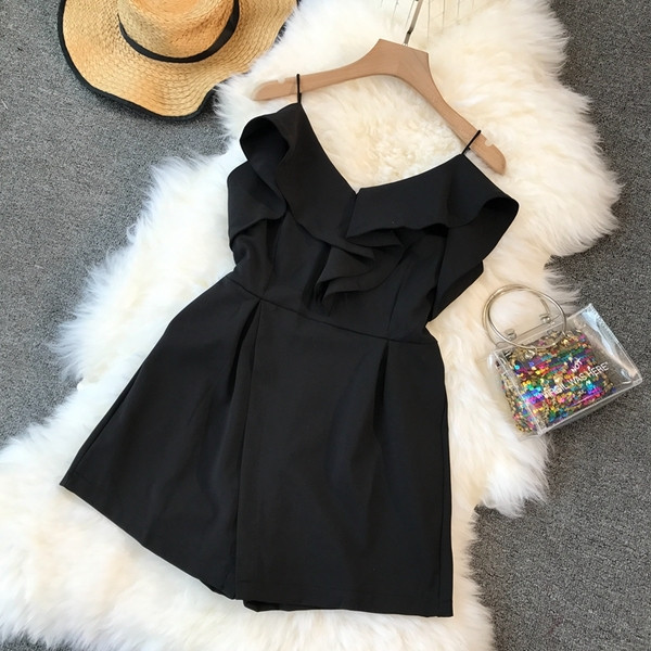 Stílusos női overall, fekete színben, V-nyakkal