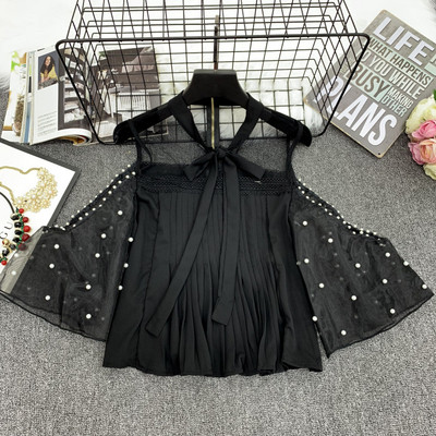 Κομψή γυναικεία μπλούζα σε λευκό και μαύρο χρώμα με τούλι και πούλιες