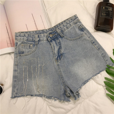 Modern női rövid farmernadrág két színben kövekkel, szakadt motívumokkal