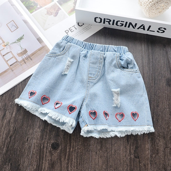 Kék színben szakadt motívumokkal ellátott modern gyerekfarmer lányoknak