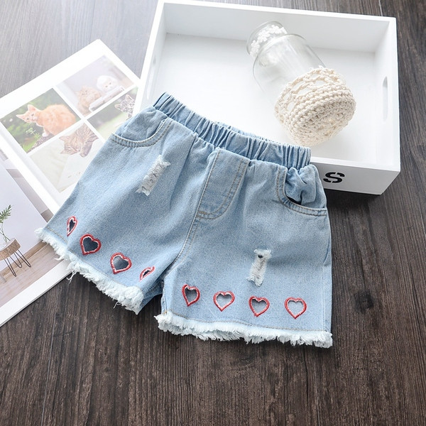 Kék színben szakadt motívumokkal ellátott modern gyerekfarmer lányoknak