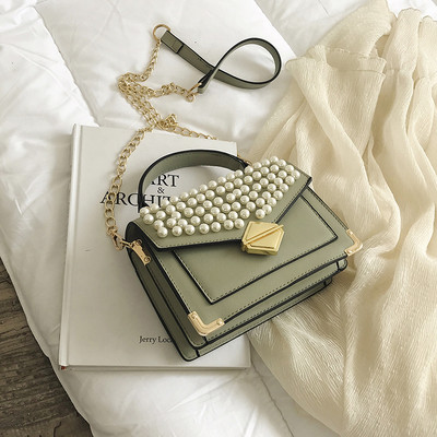 Modern női műbőr négy színben, dekorgyöngyökkel és fém rögzítéssel