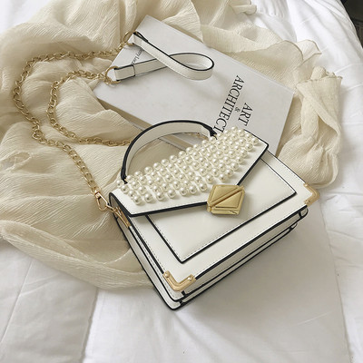 Modern női műbőr négy színben, dekorgyöngyökkel és fém rögzítéssel