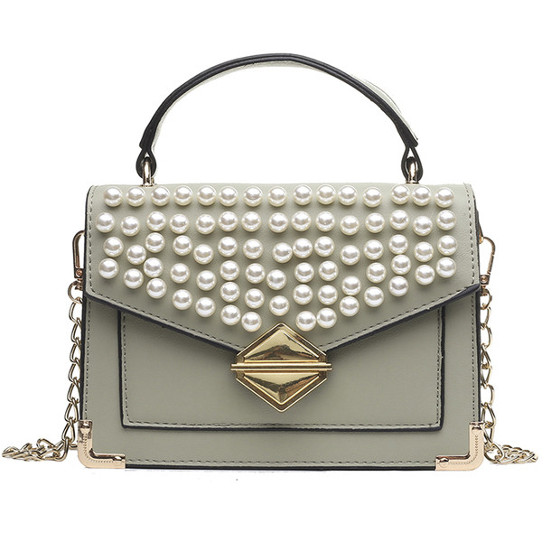 Modern női műbőr négy színben, dekorgyöngyökkel és fém rögzítéssel