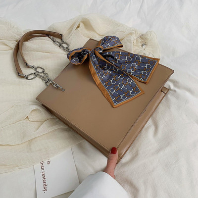 Κομψή γυναικεία έκο δερμάτινη τσάντα  σε τρία χρώματα με κορδέλα