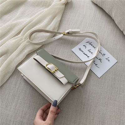 Öko bőrből készült modern női táska négy színben fém elemekkel és hosszú füllel