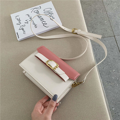 Öko bőrből készült modern női táska négy színben fém elemekkel és hosszú füllel