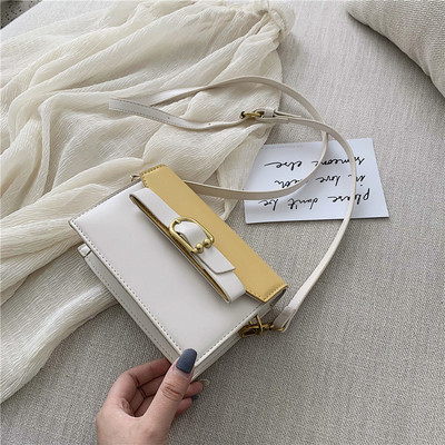 Öko bőrből készült modern női táska négy színben fém elemekkel és hosszú füllel