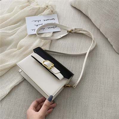 Öko bőrből készült modern női táska négy színben fém elemekkel és hosszú füllel