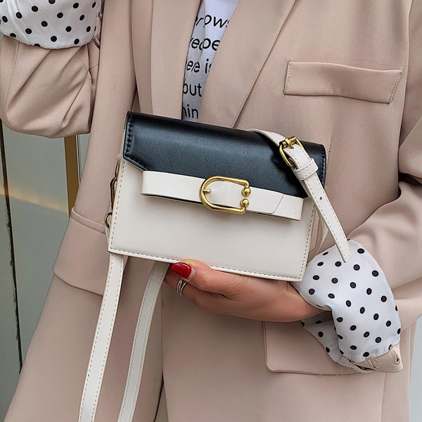 Öko bőrből készült modern női táska négy színben fém elemekkel és hosszú füllel