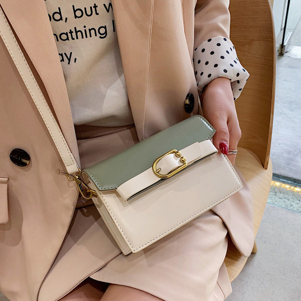 Öko bőrből készült modern női táska négy színben fém elemekkel és hosszú füllel