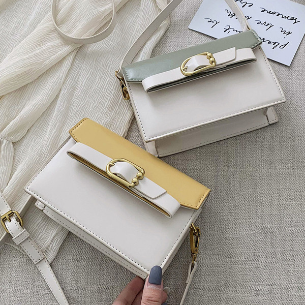 Öko bőrből készült modern női táska négy színben fém elemekkel és hosszú füllel