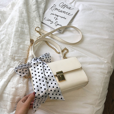 Σύγχρονη γυναικεία τσάντα σε τέσσερα χρώματα με κορδέλα και μικρή και μακριά λαβή