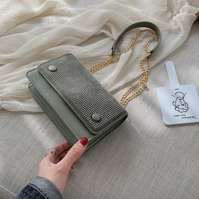 Modern női táska négy színben kövekkel és fémlánccal