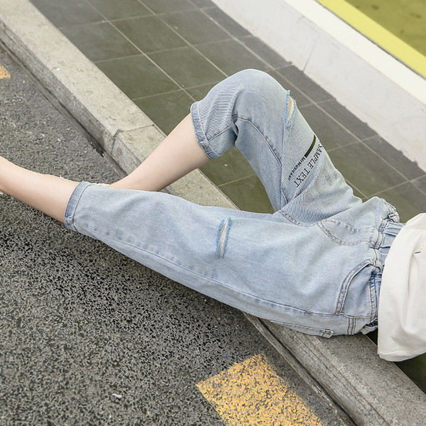 Modern gyerekfarmer szakadt motívumokkal - lányoknak