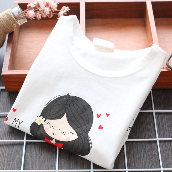 Fehér színű, rátéttel ellátott gyerekpóló lányoknak