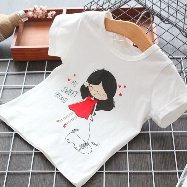 Fehér színű, rátéttel ellátott gyerekpóló lányoknak