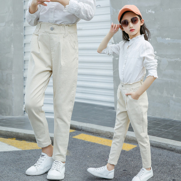 Modern gyereknadrág lányoknak fehér és rózsaszín színben