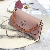 Öko bőrből készült modern női táska négy színben fém díszítéssel, rövid és hosszú füllel