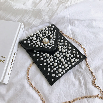 Μοντέρνα γυναικεία  τσάντα  με πέρλες  και μεταλλική αλυσίδα σε τέσσερα χρώματα οικολογικό δέρμα