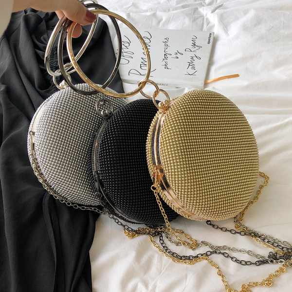 Κομψή γυναικεία τσάντα με στρογγυλό σχήμα σε τρία χρώματα με μικρή και μακρά λαβή