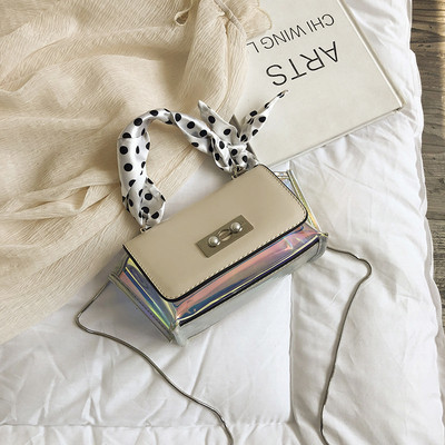 Stílusos női táska irizáló színekben, fém rögzítéssel, rövid és hosszú fülekkel