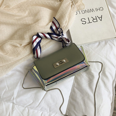 Stílusos női táska irizáló színekben, fém rögzítéssel, rövid és hosszú fülekkel