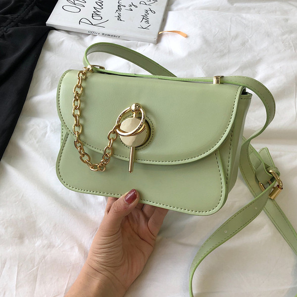 Geanta de dama moderna din piele ecologica in patru culori cu elemente metalice 3D si maner lung