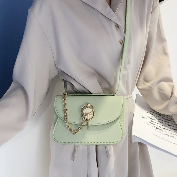 Geanta de dama moderna din piele ecologica in patru culori cu elemente metalice 3D si maner lung