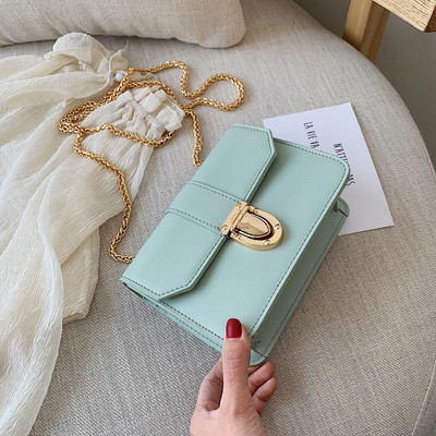 Μοντέρναγυναικεία έκο  δερμάτινη τσάντα σε πέντε χρώματα με μεταλλικό κούμπωμα και μακρά αλυσίδα