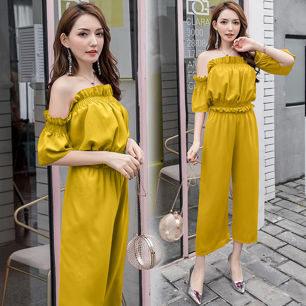 Μοντέρνες γυναικείες ολόσωμες φόρμες  με γυμνούς ώμους σε κόκκινο, κίτρινο και μαύρο χρώμα