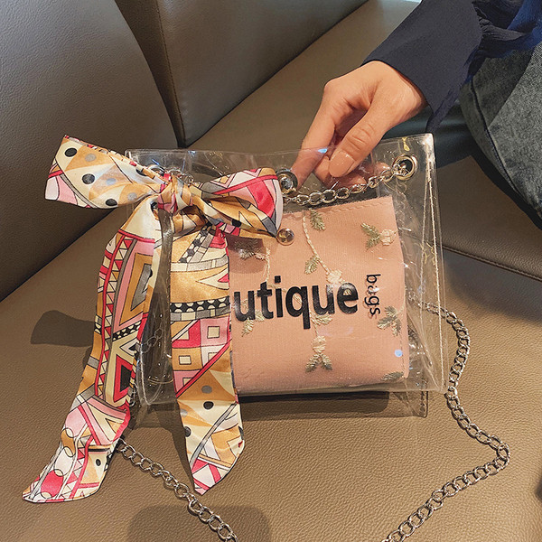 Geanta de dama moderna cu husa transparenta si broderie in patru culori