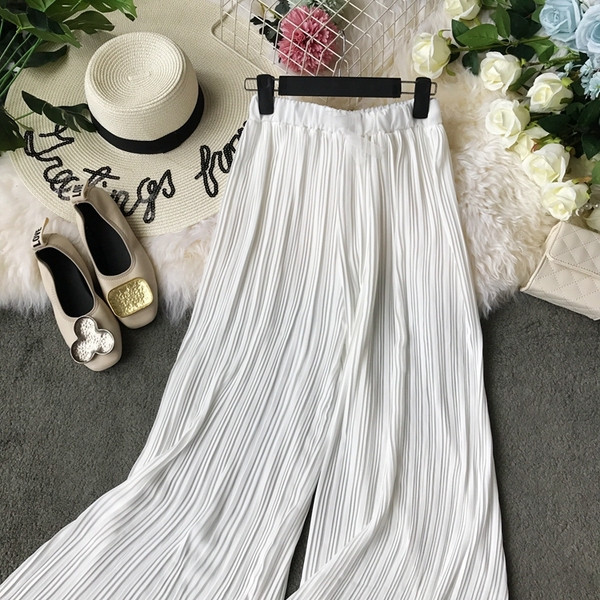 Pantaloni moderni de damă cu talie înaltă în alb și negru