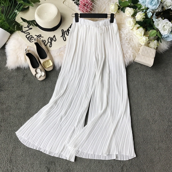 Pantaloni moderni de damă cu talie înaltă în alb și negru