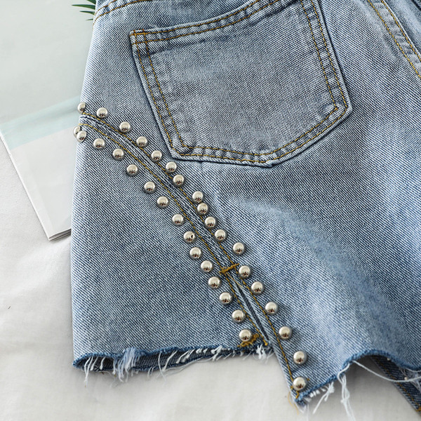 Blugi de dama cu decor metalic