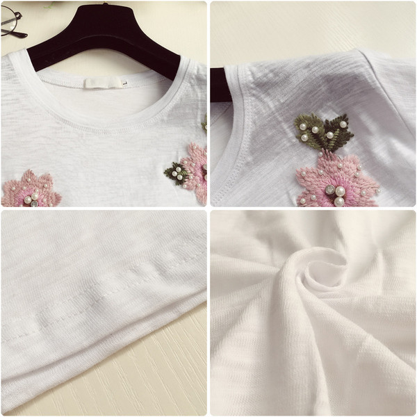 Női póló hímzéssel és gyöngyökkel fehér és fekete színben